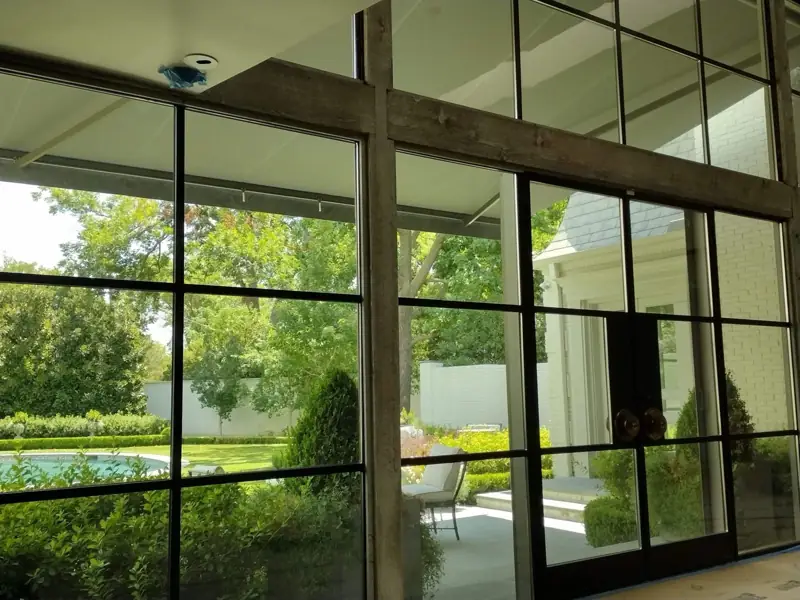 Window film on steel windows facing the pool