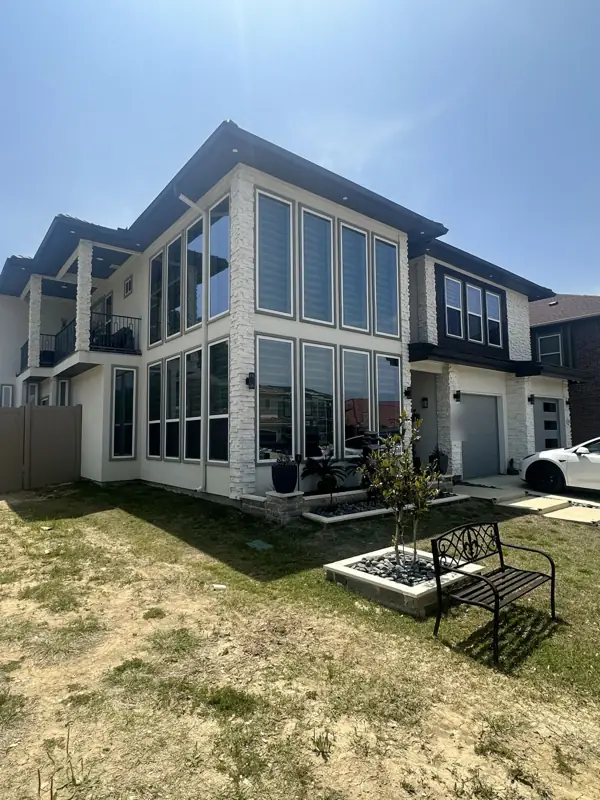 Floor-to-ceiling house windows with film
